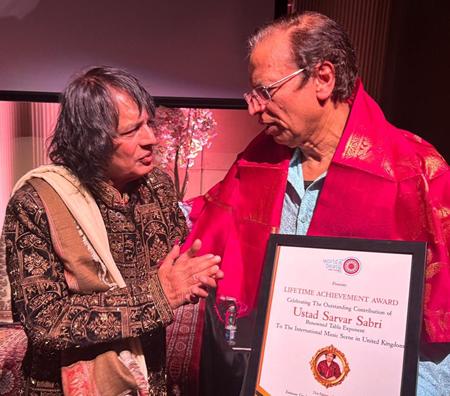 Legendary Tabla Maestro Ustad Tari Khansahb And Sahana Gero MBE Artistic Director Of World Heart Beat Music Academy, London Presented The Award To Ustad Sarvar Sabri